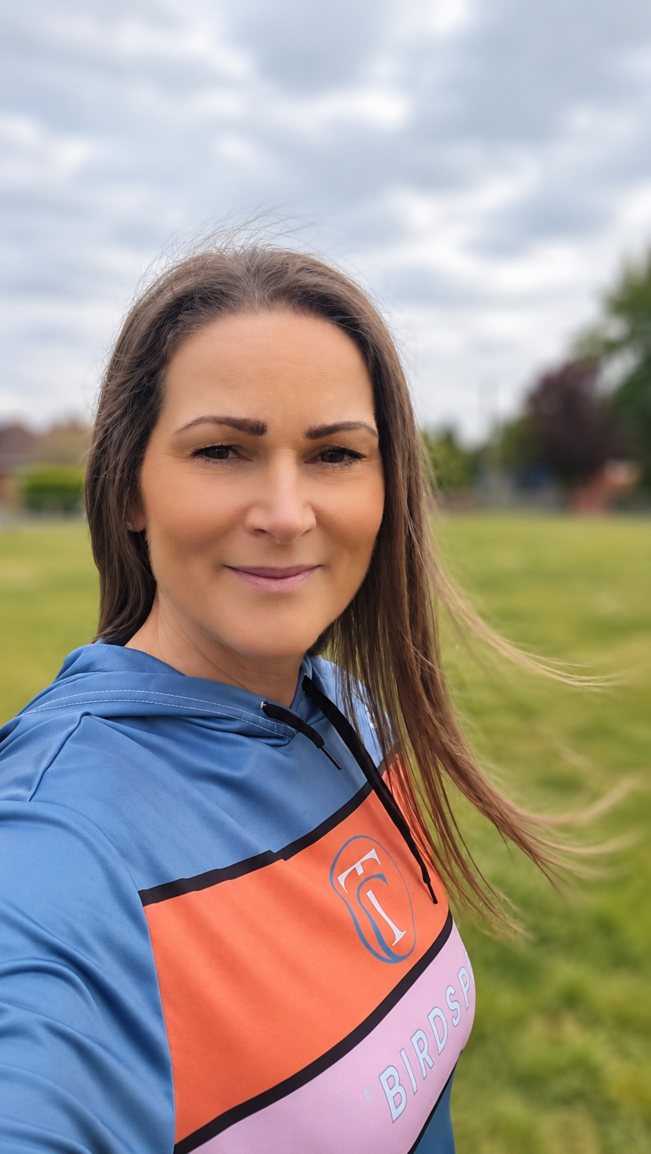 Jennie Jones, triathlon coach and founder of Tribirdsport, outdoors in Tribirdsport kit