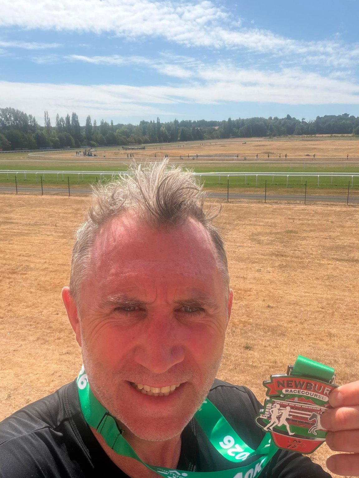 Mark, a Tribirdsport athlete, taking a selfie with his Newbury medal